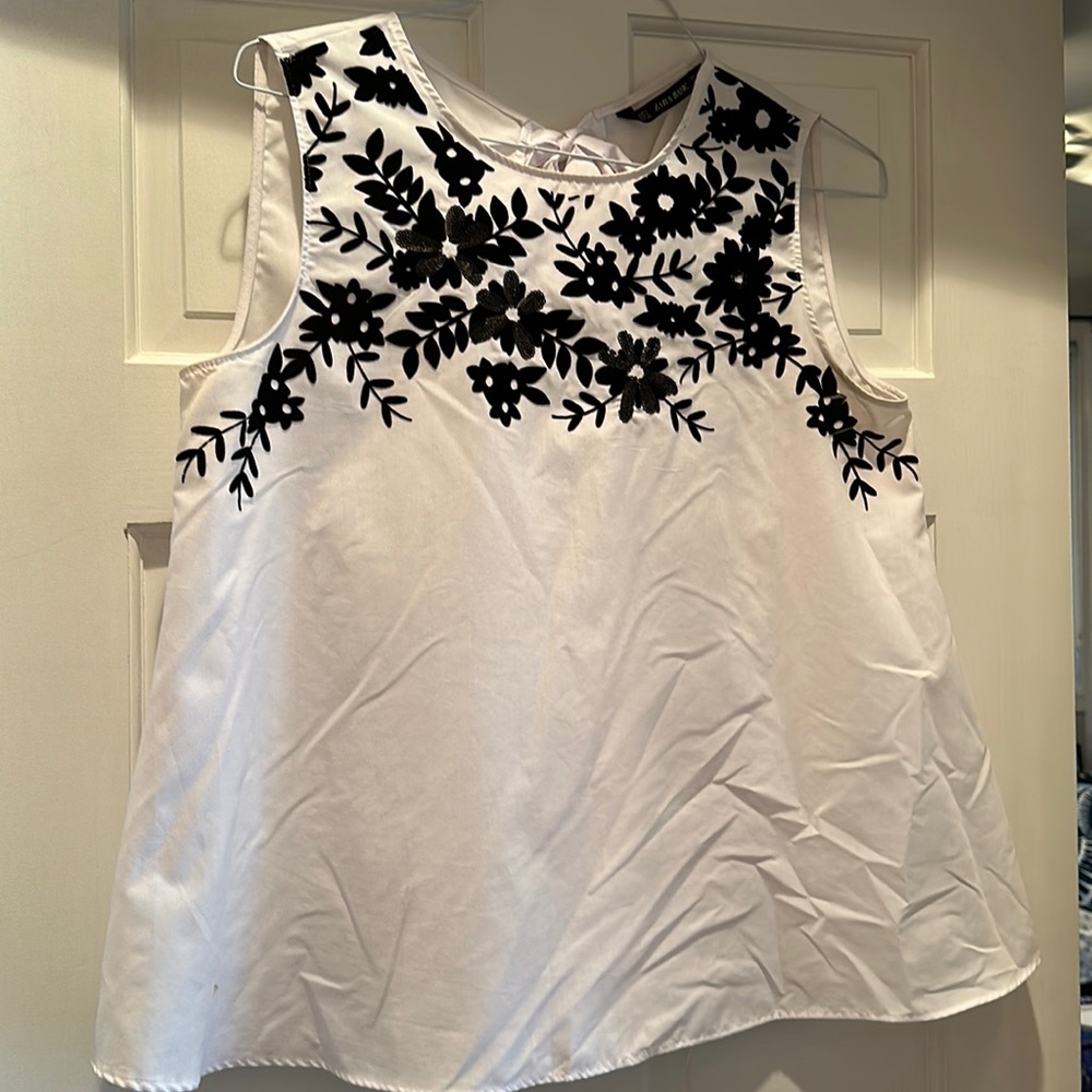 Good condition, flare style tank with unique black sequin and velour neckline